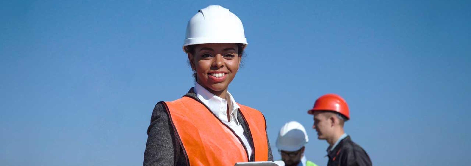 A group of people with white hard hats