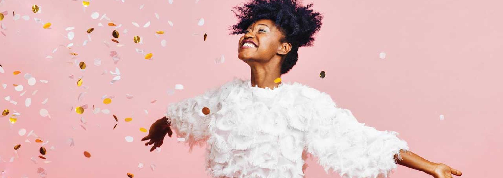 A person with raining confetti