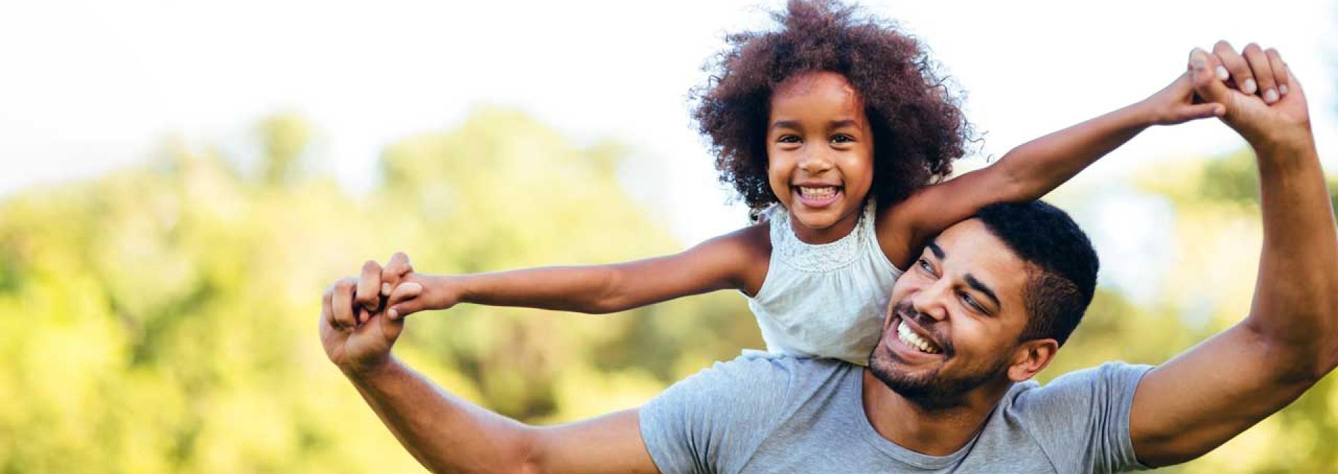 Father holding daughter 