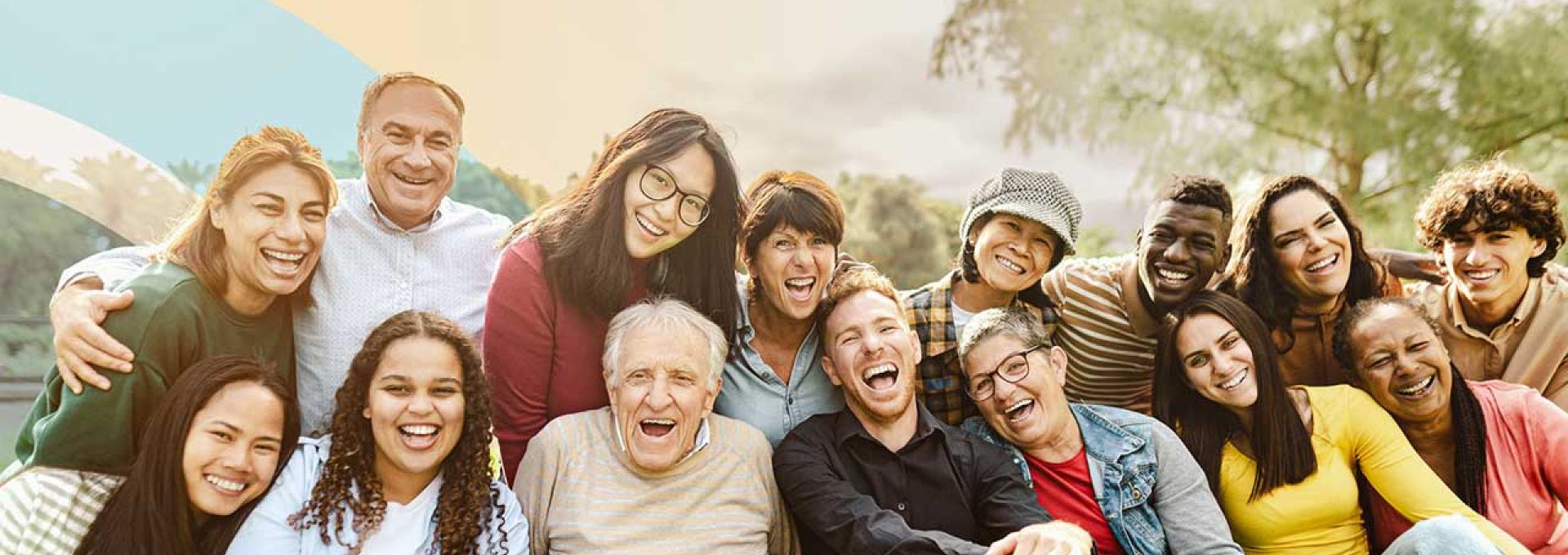 A diverse group of people are looking at the camera